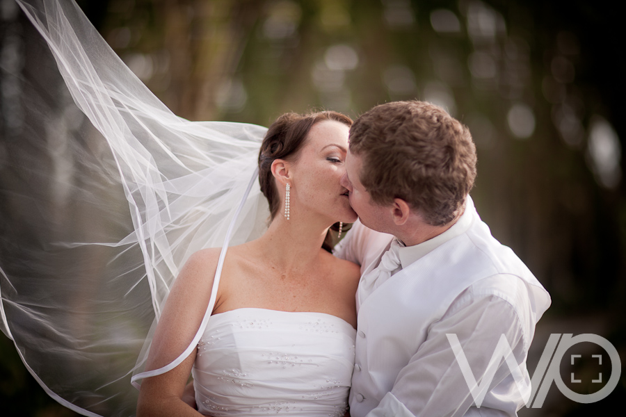 Blowing veil wedding photo